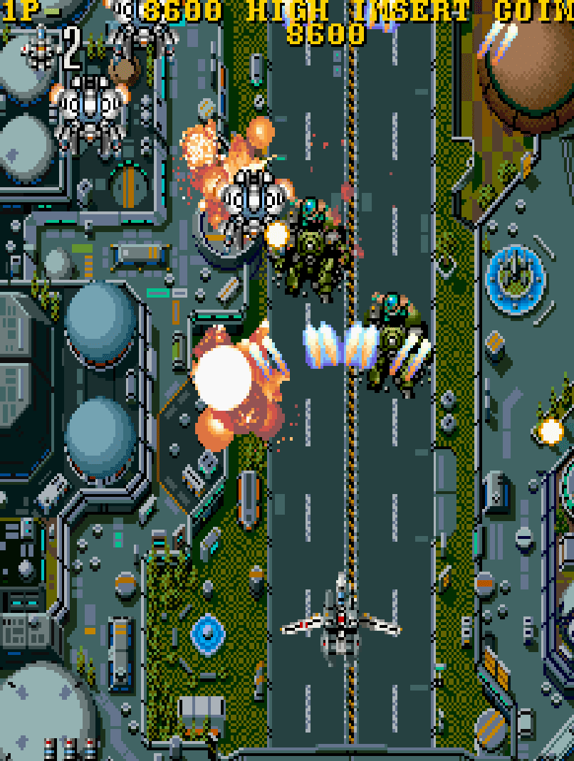 vertically scrolling shooter with Macross mecha and explosions.